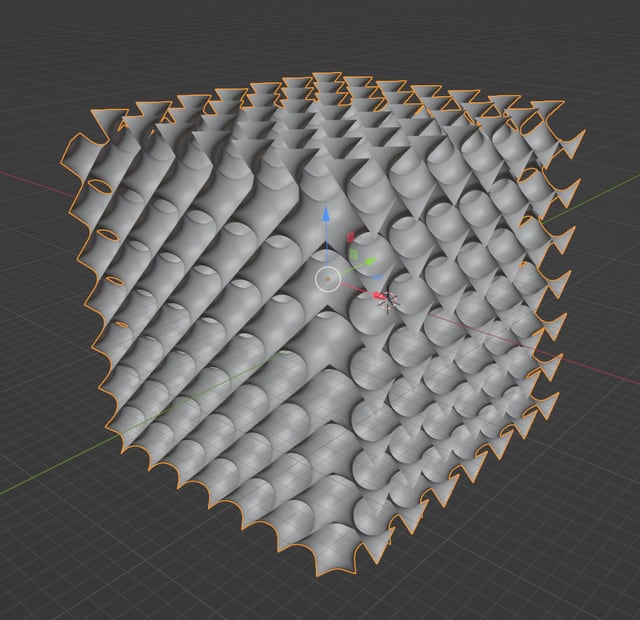 A block of saddle cells repeated in all three perpendicular directions, forming a continuous lattice shaped like a cube.